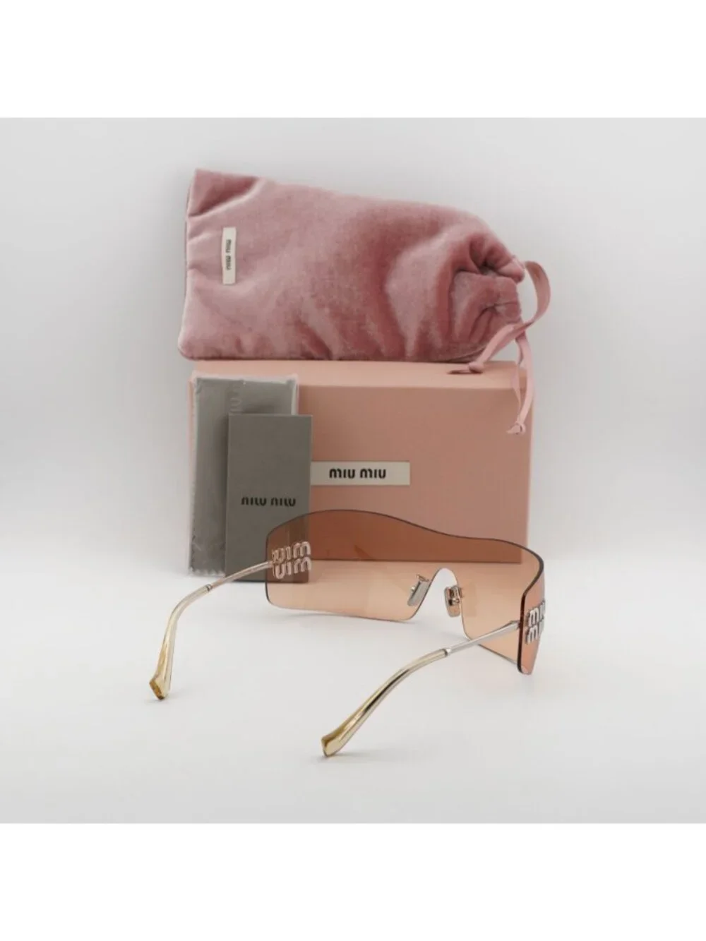 Miu Miu MUB53S 1BC80Y Sunglasses Silver Shield Frame, Orange Lenses